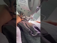 パッドをアームホールに固定し,端を削る 縫製機